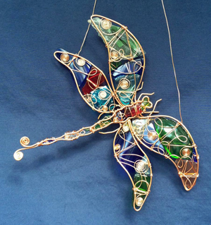 Cornelia Hoover, the creative spirit behind Seaglass Creations, pieces together different gauges of wire, sea glass and tumbled recycled glass to craft creations that are both whimsical and elegant.